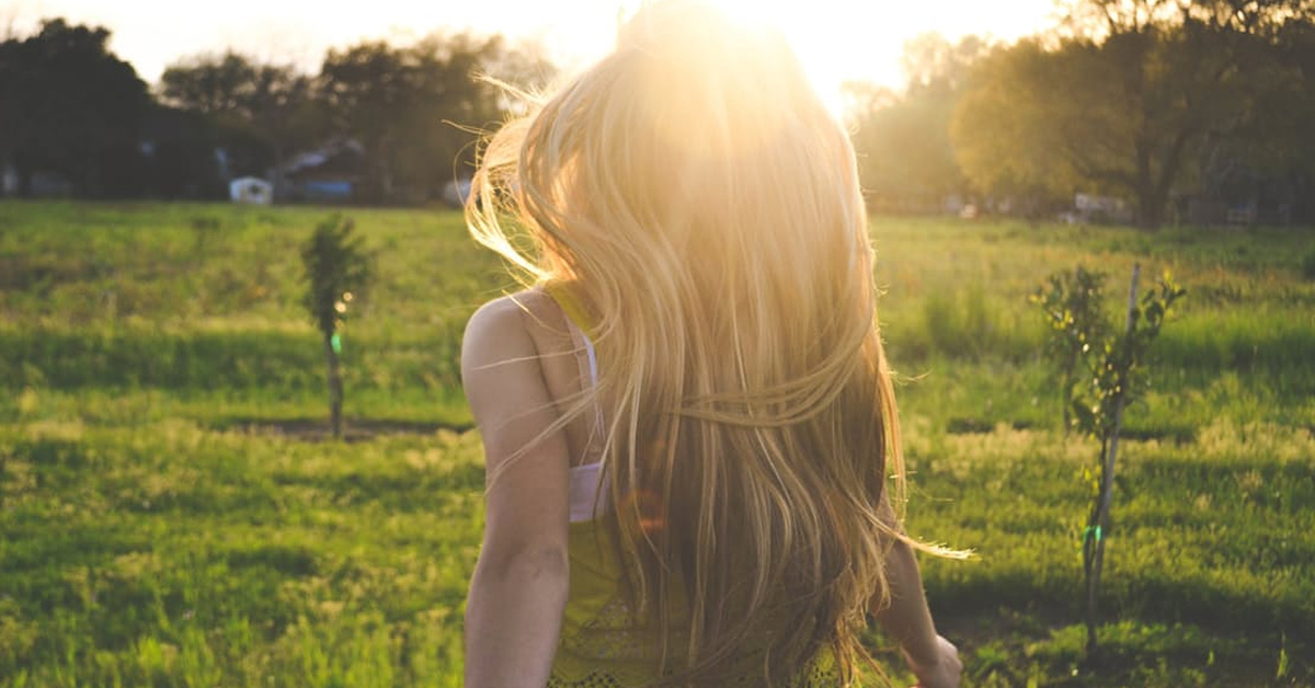 Image of woman walking in sunshine