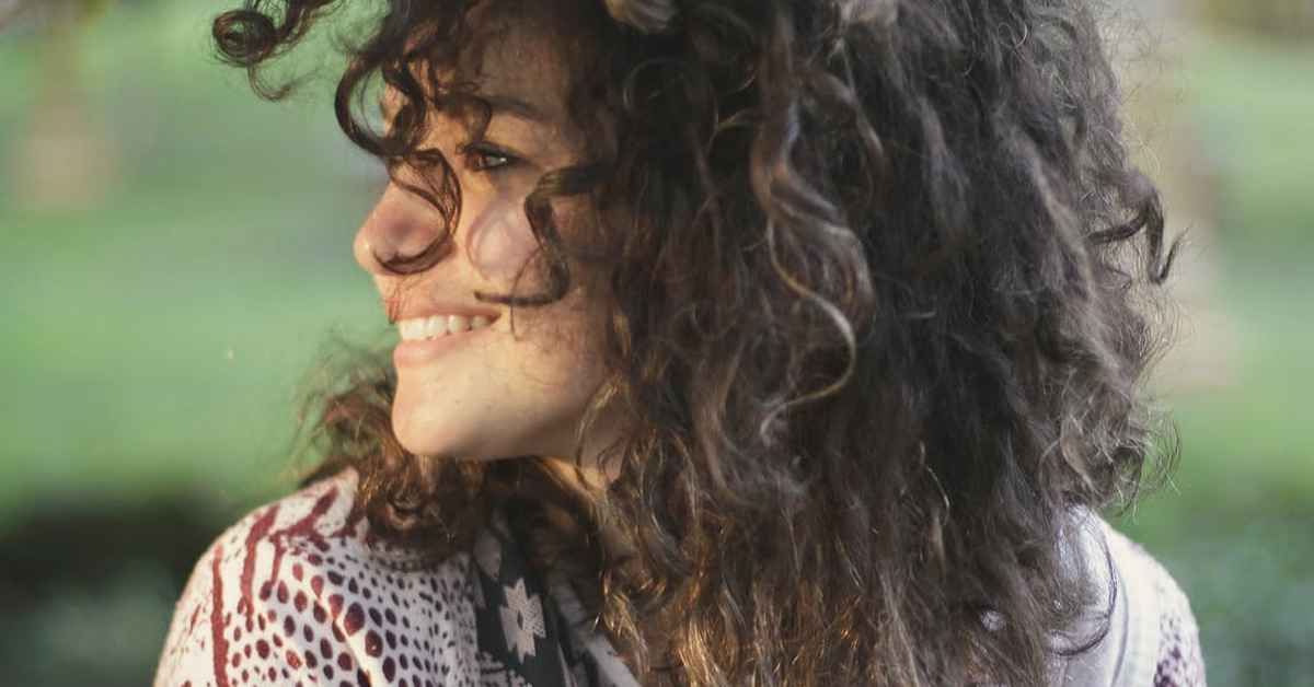 image of a woman with curly hair