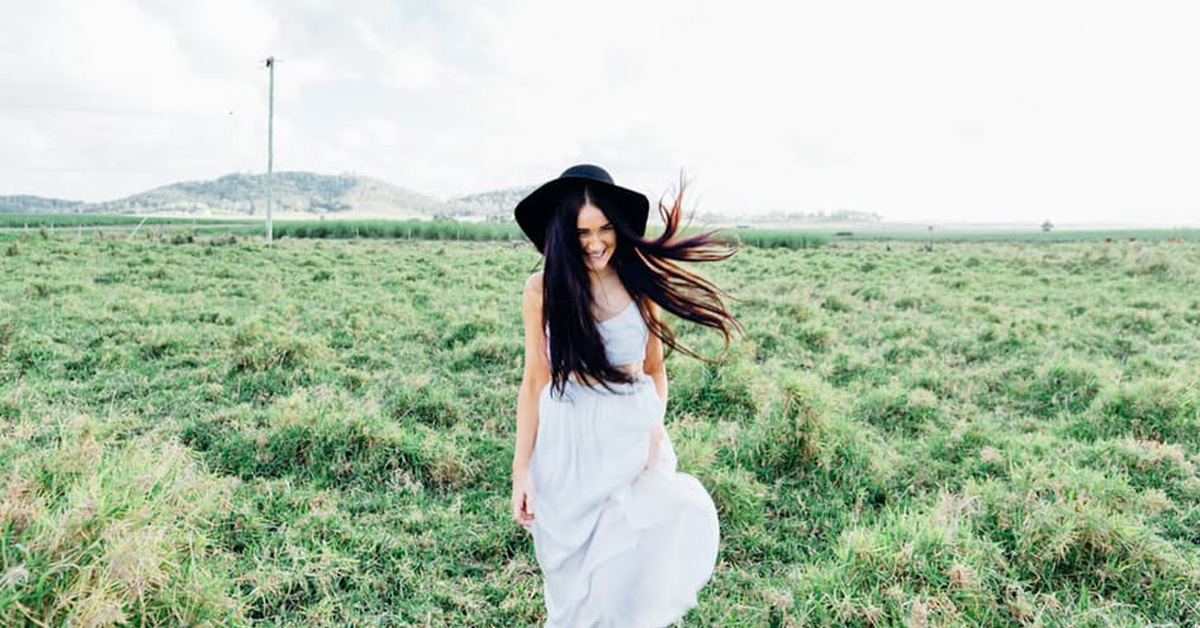 Image of a woman walking in a field