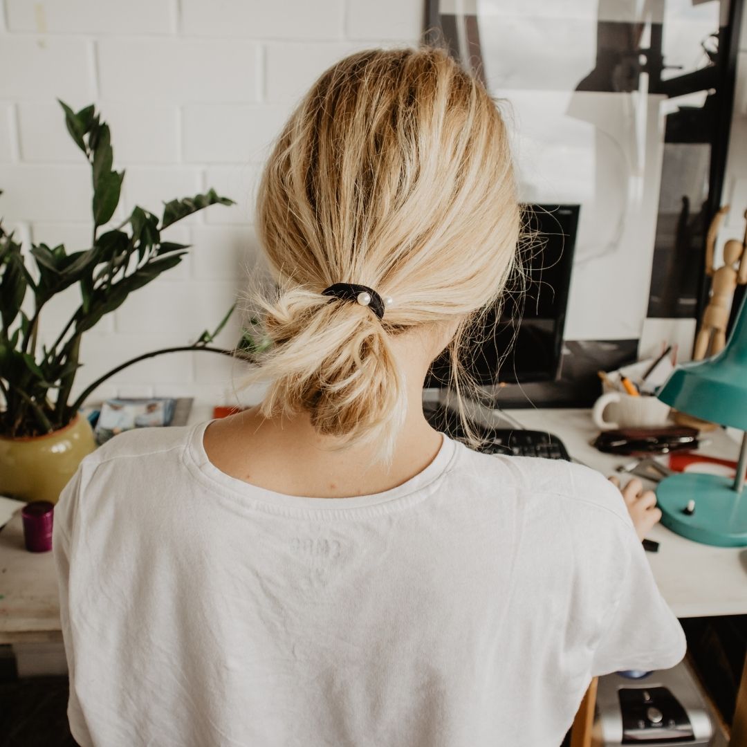 blonde working at desk